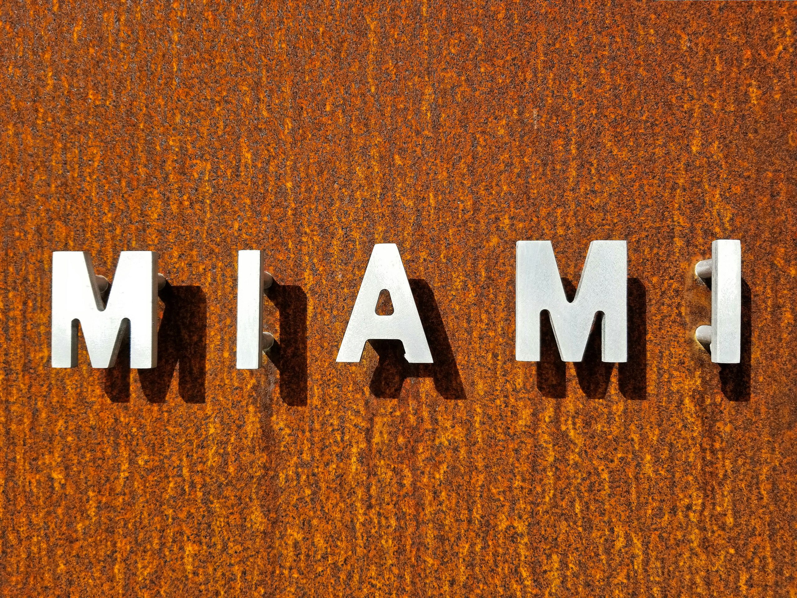 Russian-speaking governess in Miami reading with two young children in Miami.